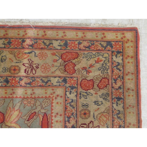 49 - A Tabriz rug, decorated with vases of flowers, on a multi-coloured ground  47