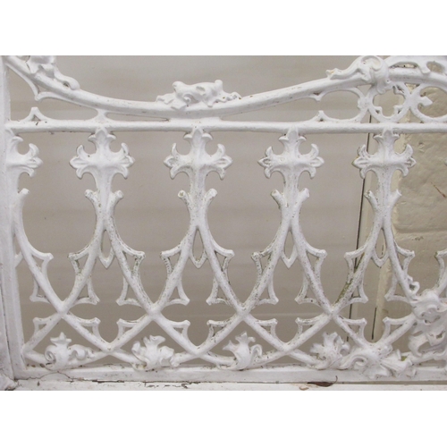 58 - A 19thC white painted, cast iron garden bench, decorated in Gothic taste with uniform quatrefoil and... 