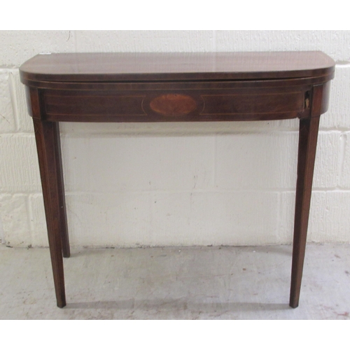 60 - An early 19thC mahogany and crossbanded satinwood D-shape tea table, the rotating foldover top raise... 