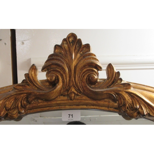 71 - A Victorian style dressing mirror, set in a moulded gilt frame, incorporating a foliate crest  70