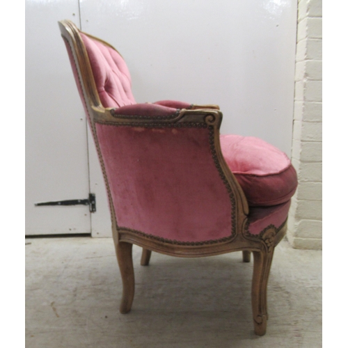 86 - A modern Louis XV inspired, stained and carved beech, showwood framed boudoir chair with enclosed ar... 