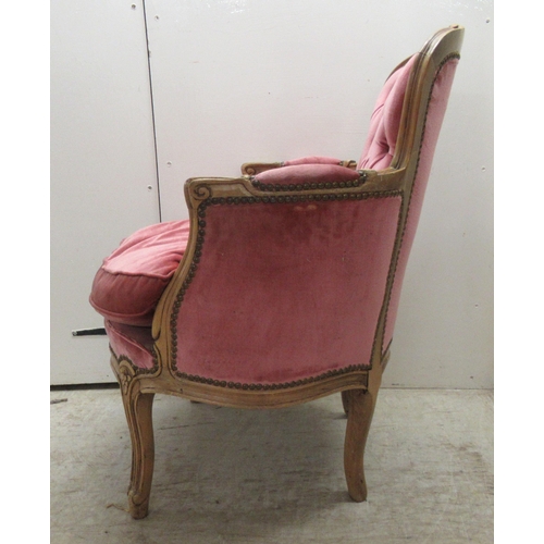 86 - A modern Louis XV inspired, stained and carved beech, showwood framed boudoir chair with enclosed ar... 