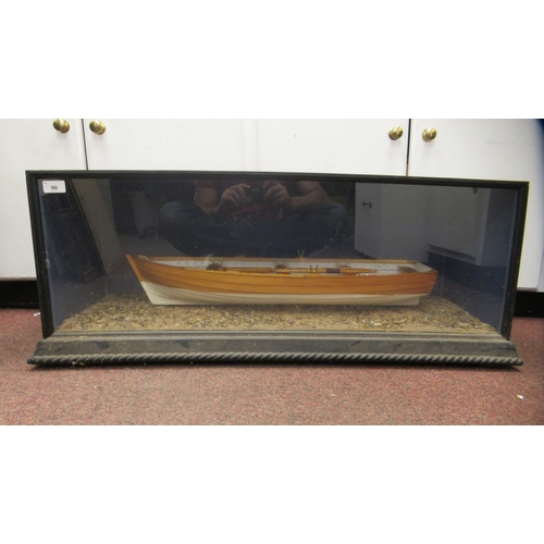 90 - A table-top model, a clinker built rowing boat with oars, total length 27