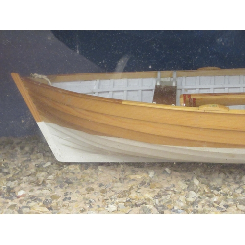 90 - A table-top model, a clinker built rowing boat with oars, total length 27