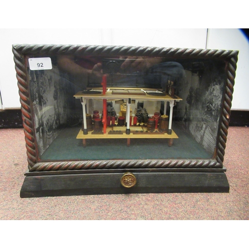 92 - A table top diorama, featuring a section of a warship's gun deck with attendant equipment, rotating ... 