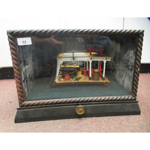 92 - A table top diorama, featuring a section of a warship's gun deck with attendant equipment, rotating ... 