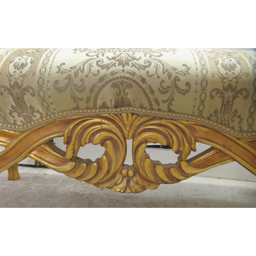 96 - A modern Louis XV inspired, carved giltwood framed window seat with scrolled ends and a shaped apron... 