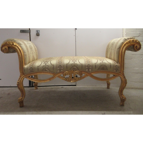 96 - A modern Louis XV inspired, carved giltwood framed window seat with scrolled ends and a shaped apron... 