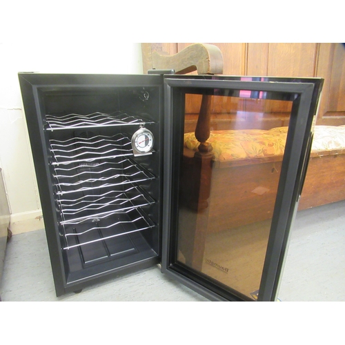 A Baumatic under counter wine fridge 25"h 14"w