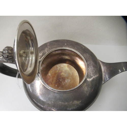 1 - A William IV silver teapot of squat, oval form with a scrolled handle  London 1830