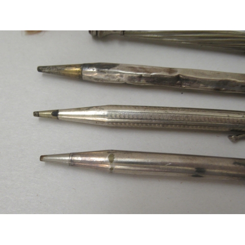 105 - Collectable writing instruments: to include silver and white metal cased pencils 