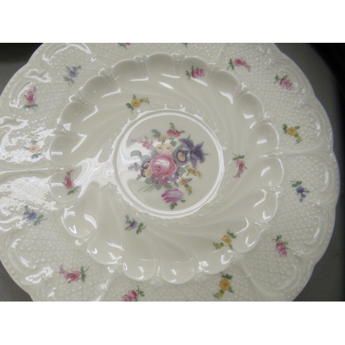 107 - A set of none black Knight Meissen Copyright china plates, decorated with floral sprigs, on a cream ... 