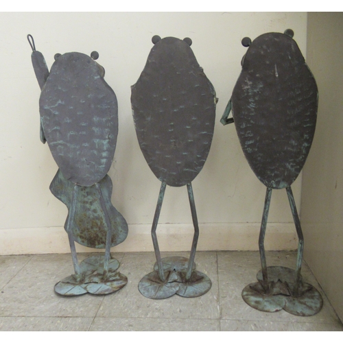 113 - Three modern steel and wrought iron cartoon frogs, jazz musicians, on lilypad stands  approx. 26