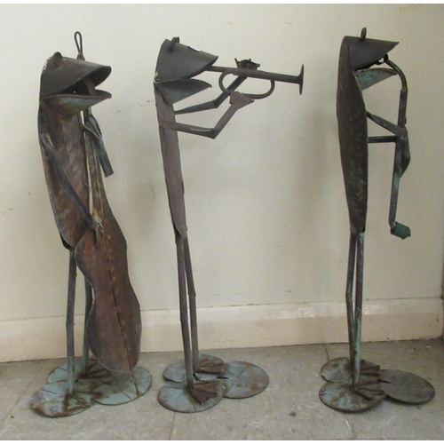 113 - Three modern steel and wrought iron cartoon frogs, jazz musicians, on lilypad stands  approx. 26