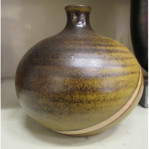 124 - Three items of Studio pottery: to include one fashioned as a red onion  4