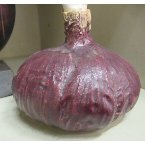 124 - Three items of Studio pottery: to include one fashioned as a red onion  4