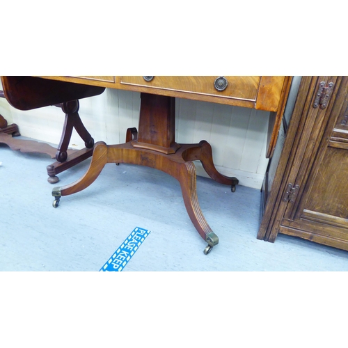 145 - A Regency mahogany sofa table, having two inline frieze drawers, cockbeading and brass ring handles ... 