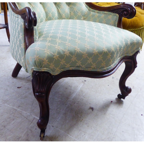 180 - A mid 19thC rosewood framed salon chair with a button upholstered green fabric back and seat, raised... 