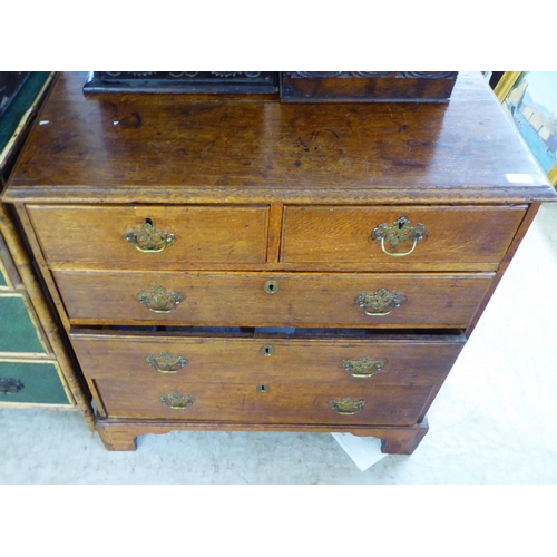 182 - A George III oak five drawer dressing chest, raised on bracket feet  36