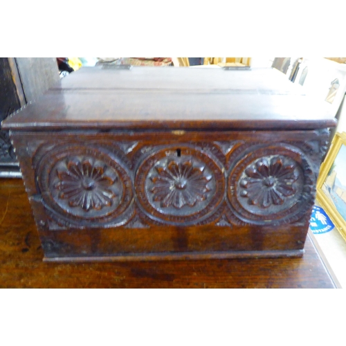 185 - A mid 18thC oak Bible box with a hinged lid and a carved panelled front  7