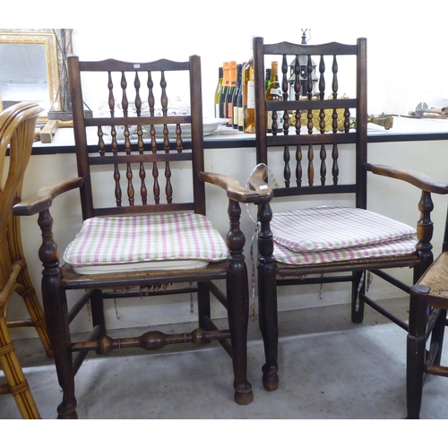 191 - A matched set of four early 19thC ash and oak framed Lancashire spindle back dining chairs, each wit... 