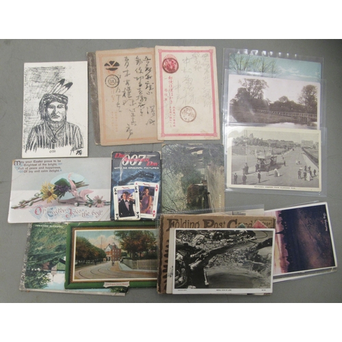 210 - Postcards, cigarette cards and playing cards: to include coastal views