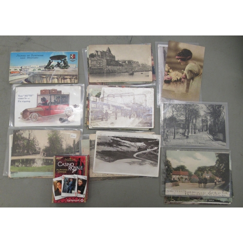 210 - Postcards, cigarette cards and playing cards: to include coastal views