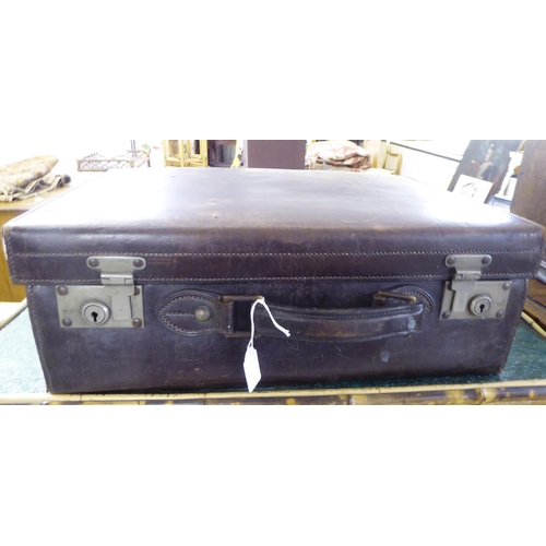 222 - A mid 20thC moulded and stitched chocolate brown hide suitcase   7