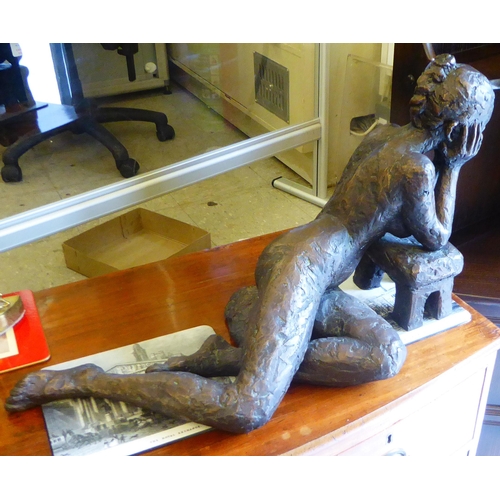 46 - A modern bronzed finished cast metal figure, a reclining nude  14