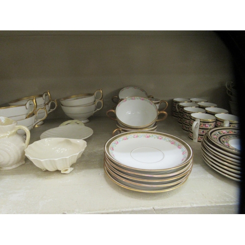 103 - Aynsley bone china tableware, variously decorated in midnight blue and gilding: to include soup bowl... 