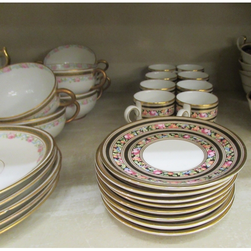 103 - Aynsley bone china tableware, variously decorated in midnight blue and gilding: to include soup bowl... 