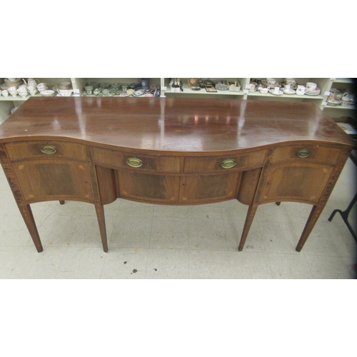 108 - An early 20thC Regency style fan marquetry and string inlaid mahogany serpentine front sideboard, co... 