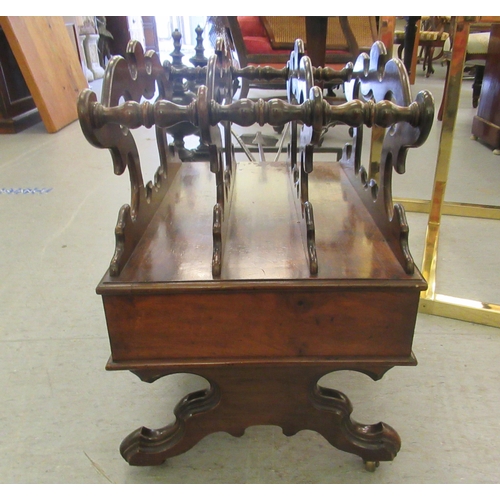 266 - A late Victorian walnut Canterbury with a divided upper section, over a base drawer, raised on splay... 