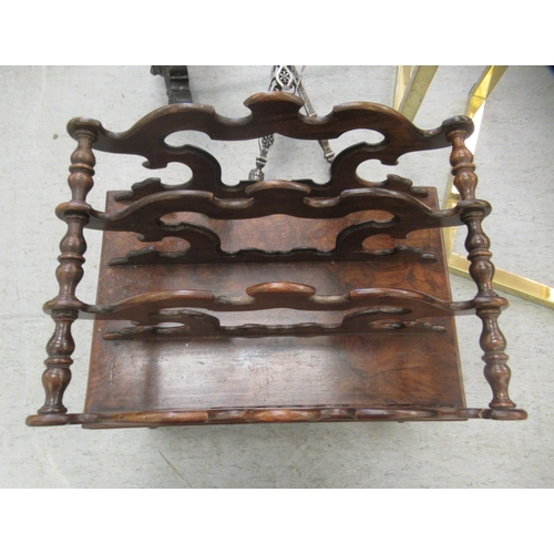 266 - A late Victorian walnut Canterbury with a divided upper section, over a base drawer, raised on splay... 