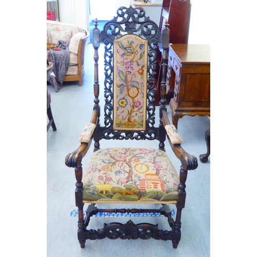 278 - A late Victorian oak framed hall chair, having an ornately pierced, carved back with a tapestry upho... 