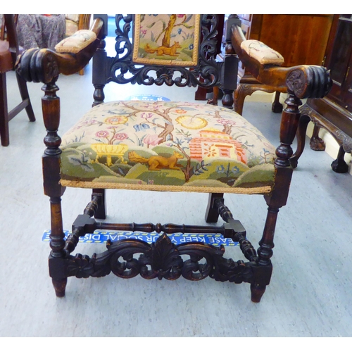 278 - A late Victorian oak framed hall chair, having an ornately pierced, carved back with a tapestry upho... 