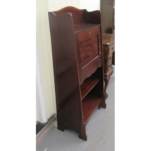 44 - An Edwardian string and ebony inlaid students bureau with a fall flap, over two open shelves, raised... 