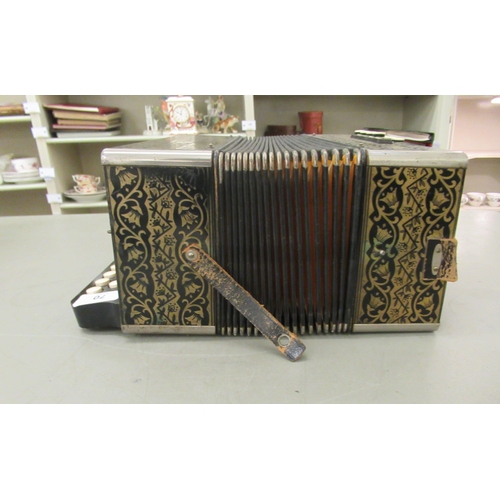 70 - A vintage twenty-one key Hohner piano accordion