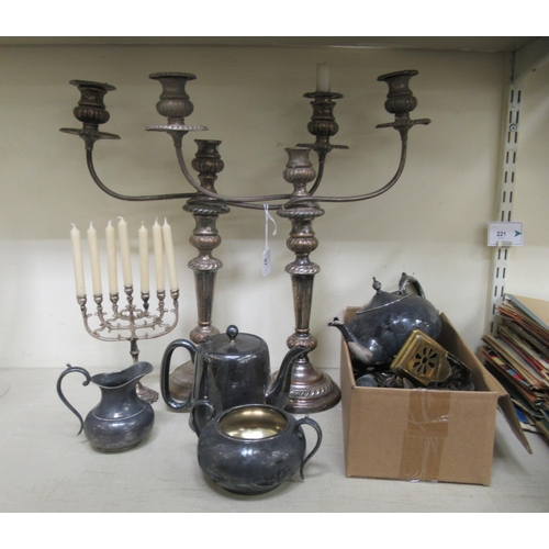 87 - Silver plate: to include a pair of 20thC Georgian style twin branch table candelabra, each with a ce... 