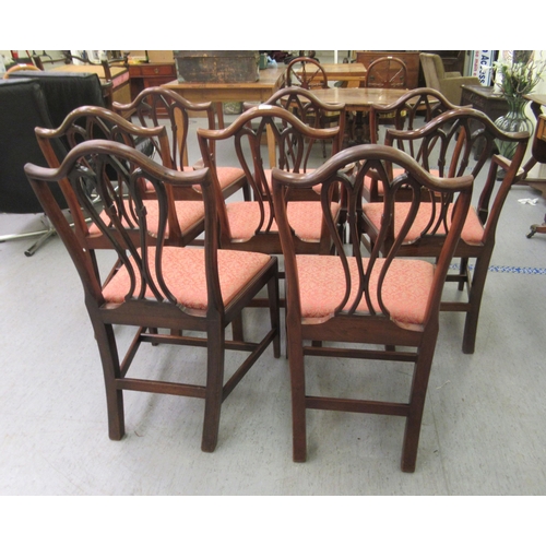 155 - A set of eight late 19th/early 20thC George III design mahogany framed dining chairs with arched bac... 