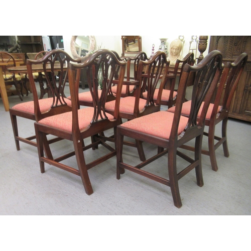 155 - A set of eight late 19th/early 20thC George III design mahogany framed dining chairs with arched bac... 