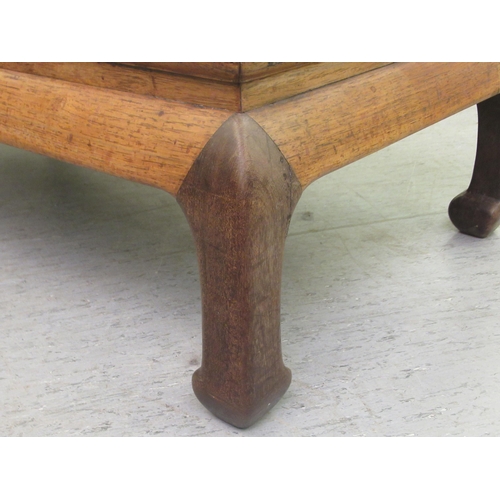 17 - An early 20thC Chinese fruitwood Kang table, the top with a mitred edge, raised on curved legs  12.5... 