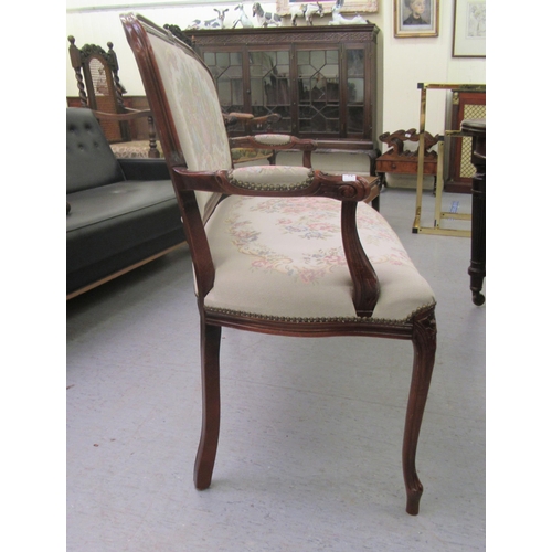 235 - A modern reproduction of a French inspired, stained beech framed, two person, cottage settee, uphols... 