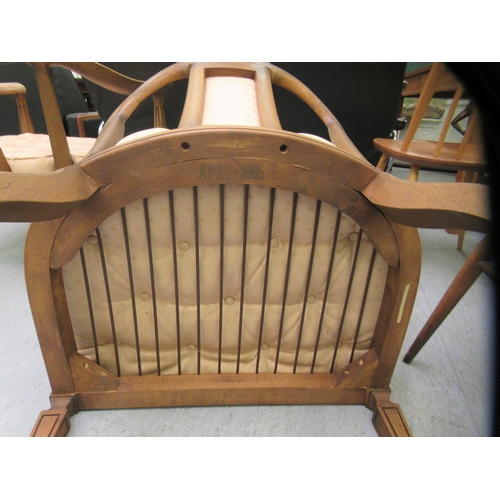 75 - A pair of 20thC antique finished walnut framed horseshoe shaped chairs with upholstered splats and b... 