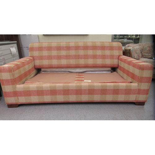 137 - A modern Kingcome two person bed settee, upholstered in a chequered patterned fabric