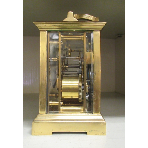 67 - A lacquered brass and glazed cased carriage timepiece; the movement faced by a Roman dial, branded f... 