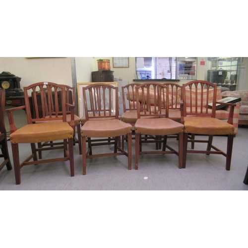 79 - A set of eight mid 20thC satin mahogany framed and carved dining chairs with stud upholstered seats,... 