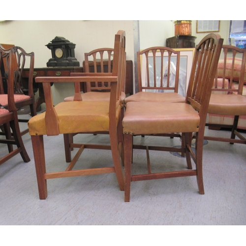 79 - A set of eight mid 20thC satin mahogany framed and carved dining chairs with stud upholstered seats,... 