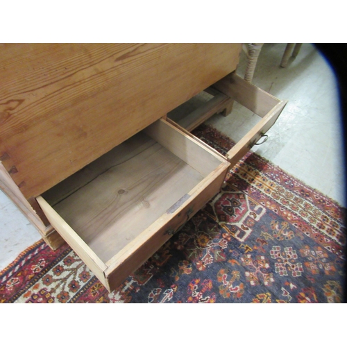 18 - A late Victorian pine blanket chest with a hinged lid, raised on bracket feet  24