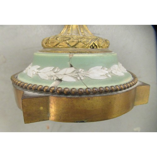 24 - A pair of Wedgwood green Jasperware and gilt metal mounted pedestal urn and cover, decorated with fr... 